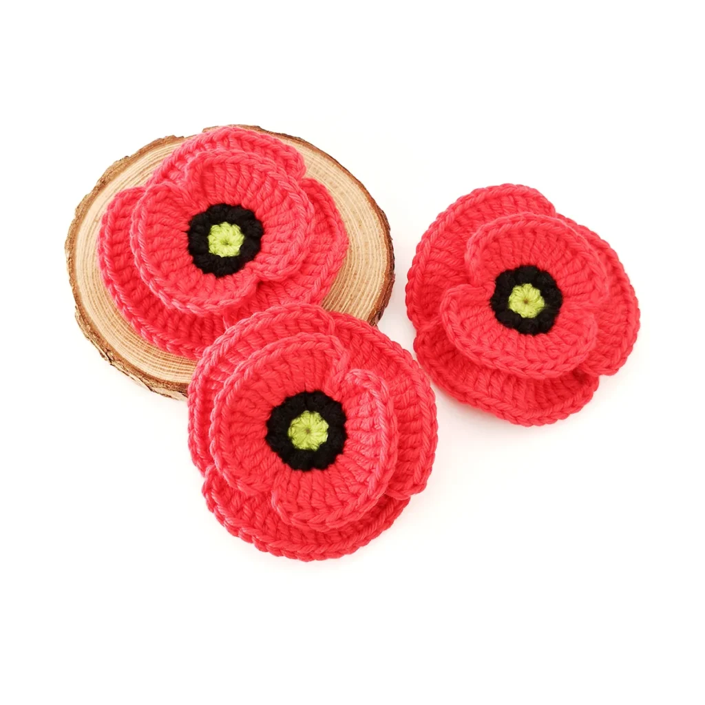 3 red crochet poppies.