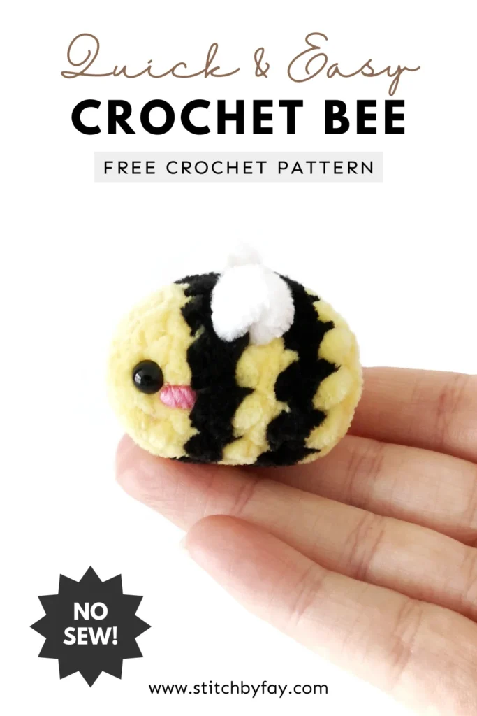 Pinterest image showing a small plush crochet bee with a pink cheek sitting on the end of a hand against a white background. Text overlay reads: "Quick & easy crochet bee, free crochet pattern, www.stitchbyfay.com" with "no-sew!" in a starburst.