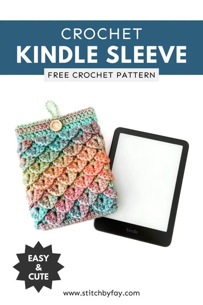Pinterest image showing a blue, green, orange and purple gradient crochet kindle sleeve lying next to a kindle on a white background, featuring a textured dragon scale stitch pattern. Text overlay reads: "Crochet kindle sleeve, free crochet pattern, www.stitchbyfay.com" with "easy & cute" in a starburst.