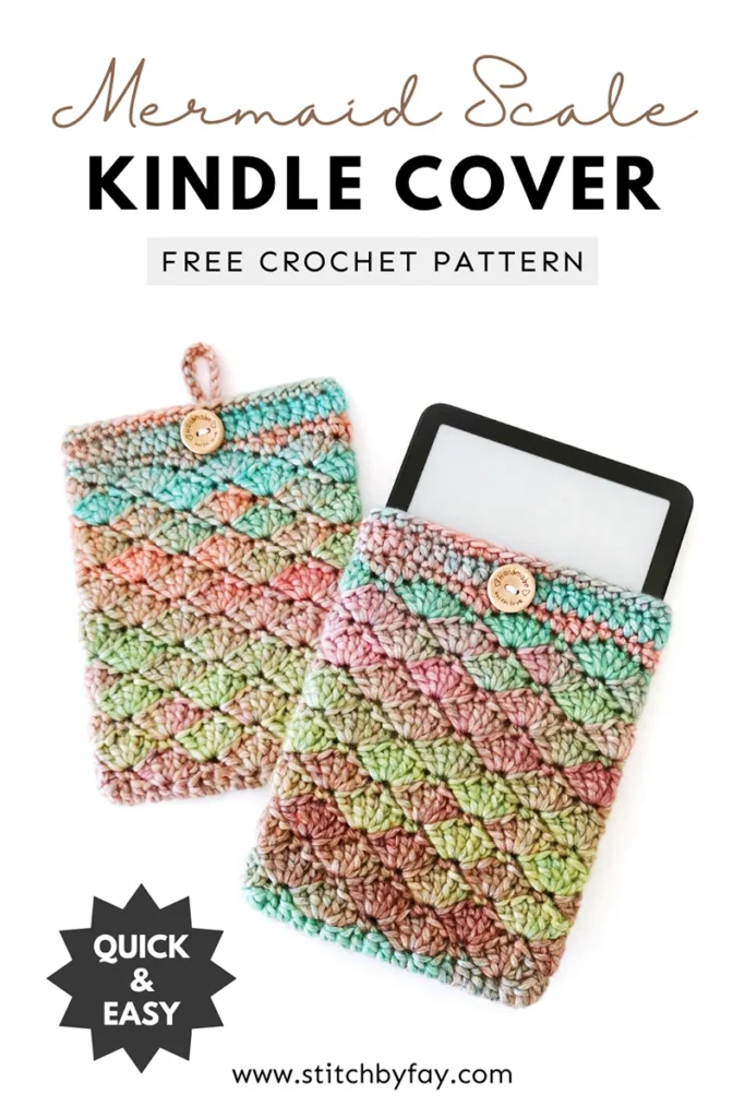 Pinterest image showing two crochet kindle covers lying overlapping slightly, with a kindle peeking out the top of one of them, featuring the shell stitch and made with soft gradient yarn in shades of green, blue, orange and purple, with a round wooden button and loop closure. Text overlay reads: "Mermaid scale kindle cover, free crochet pattern, www.stitchbyfay.com" with "quick & easy" in a starburst.